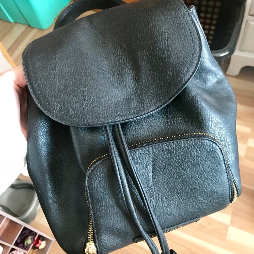 Black faux-leather backpack